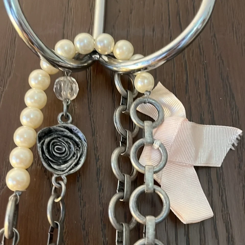 Women’s double chain belt. One of metal objects and the second chain of pearls.